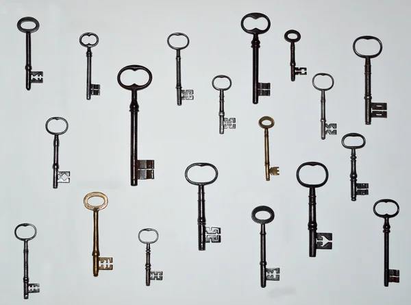 19 Antique Keys on a white background