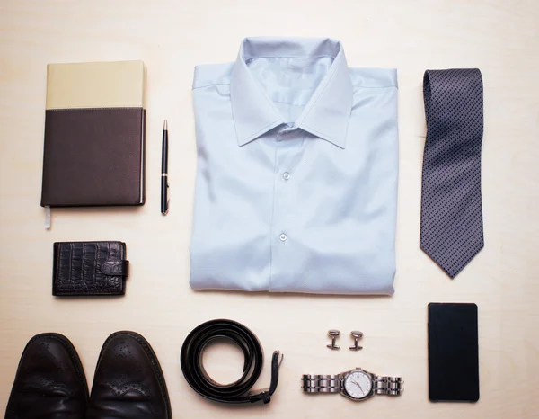 Mens classic outfit with blue shirt, tie and accessories