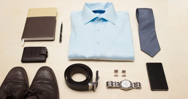 Mens classic outfit with blue shirt, tie and accessories