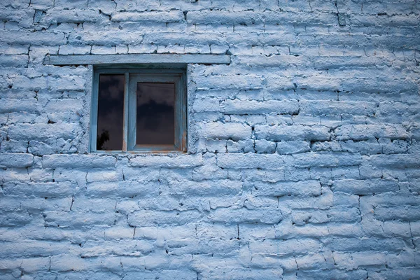 Old blue adobe brick wall background