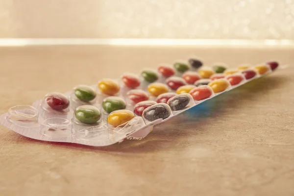 Colored pills in a package