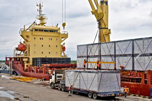Cargo ship loading cargo into the ship