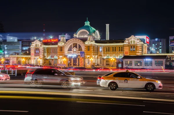 Late night traffic blurs past in Seoul Station at night in South