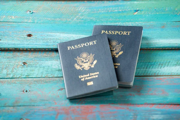 American passports on a distressed blue background