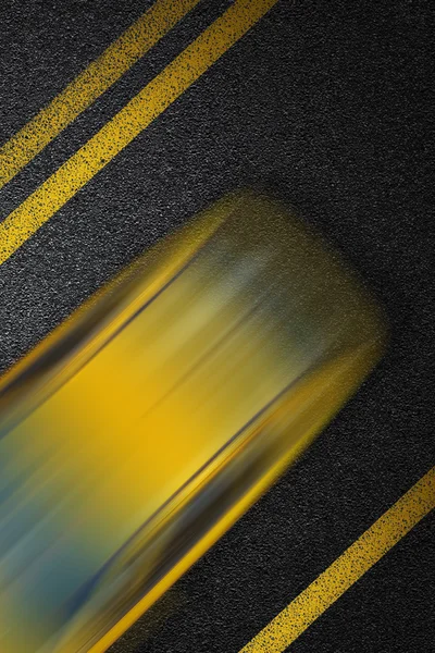 Level asphalted road with a dividing yellow stripes and moving with at high speed the vehicle cab. The texture of the tarmac, top view.