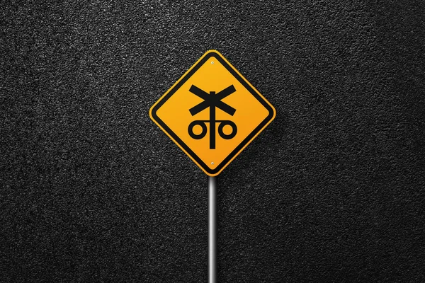 Road sign of the diamond shape on a background of asphalt. Railway. The texture of the tarmac, top view.
