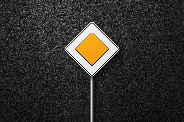 Sign main road on a background of asphalt. The texture of the tarmac, top view.