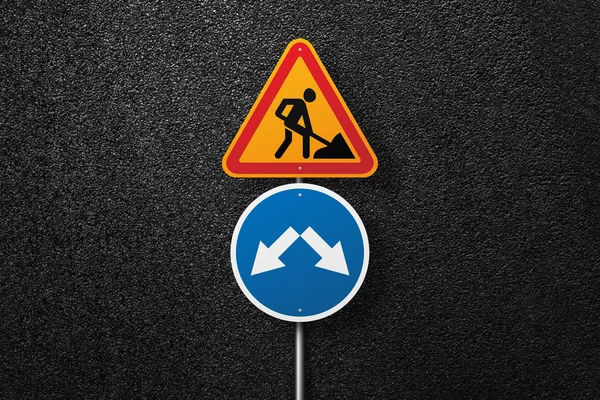 Road signs of the circular and triangular shape with a picture of a worker on a background of asphalt. Pointer. The texture of the tarmac, top view.