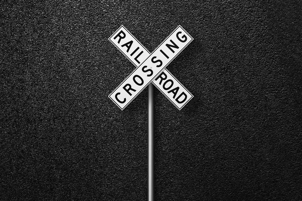 Road sign on a background of asphalt. The texture of the tarmac, top view.