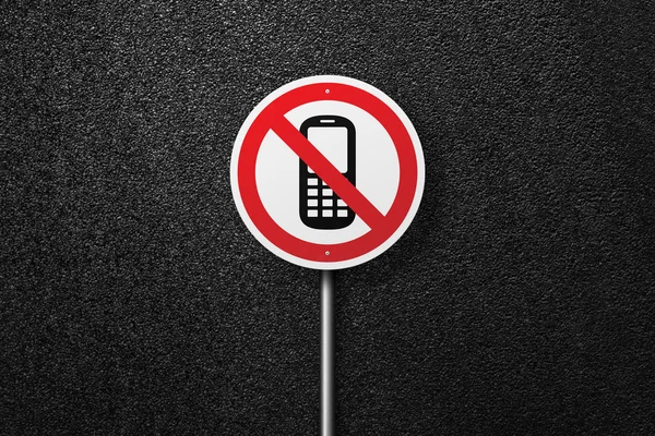 Road sign of the circular shape on a background of asphalt. No phones and sms. The texture of the tarmac, top view.
