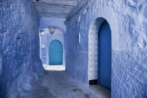 Travel between the beautiful streets of the blue city of Chefchaouen in Morocco