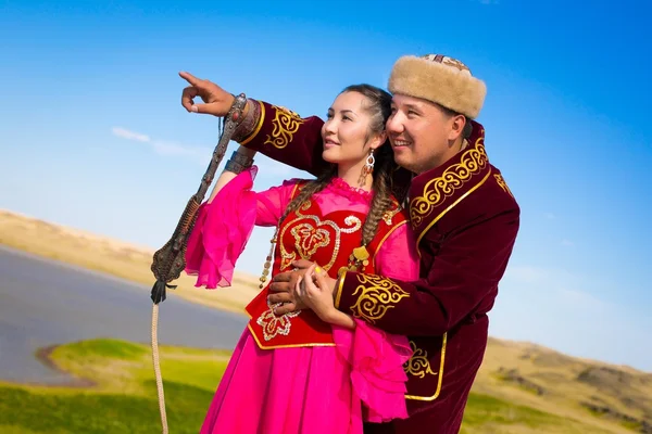 Man and woman in Kazakh national costumes