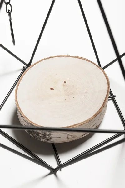 A black interior prop for candle with birch
