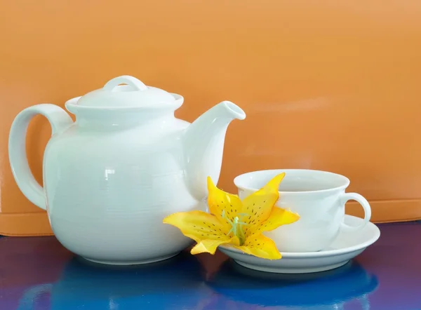 Cup of tea with teapot lit background, pop art style