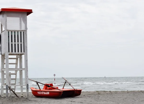 Lifeguard with rescue pedal boats and tower in lignano sabbiadoro Italy