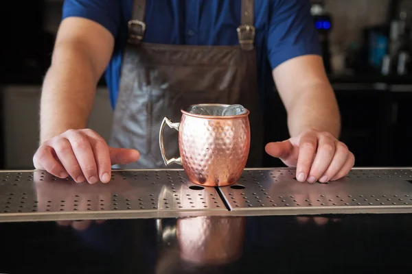 Bartender hands on the counter