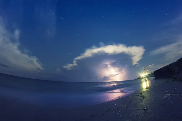 Storm with clouds and lightning over the sea