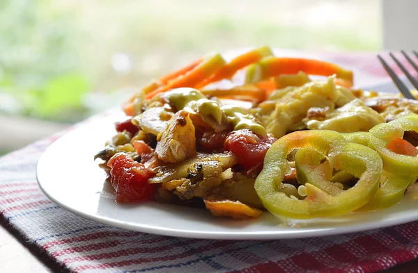 Cooked vegetables and scrambled eggs