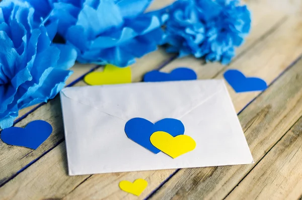 Letter with yellow and blue hearts