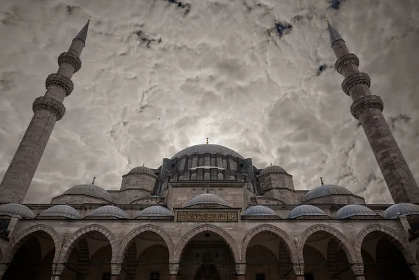 Blue mosque under cloudy sky