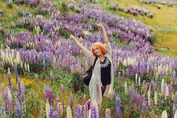 Red-haired girl in a field of lavender