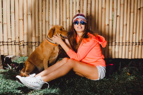 Happy Hipster Girl with her Dog