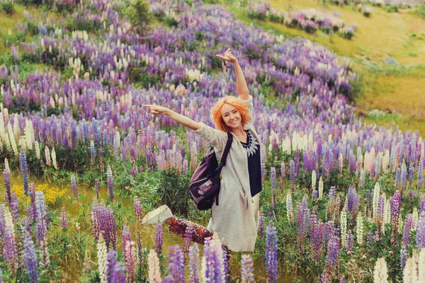 Red-haired girl in a field of lavender