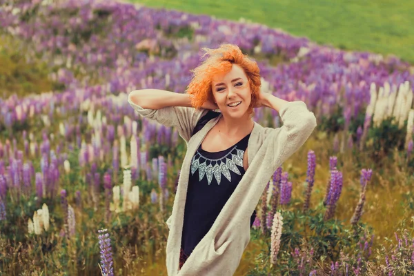 Red-haired girl in a field of lavender