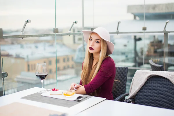 Young woman drinking red wine