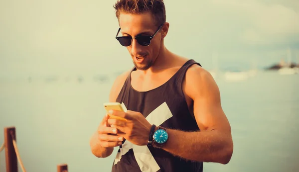 Young guy  talking on the smartphone