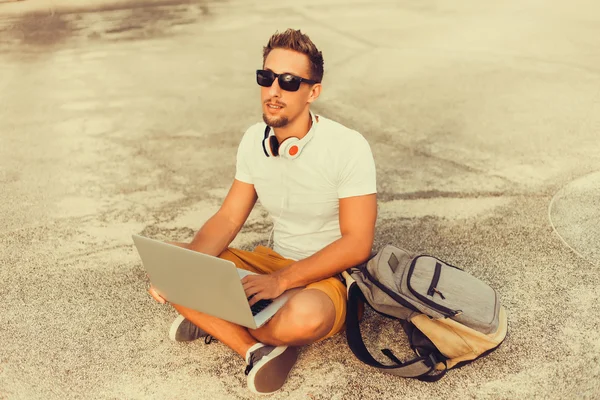 Young man   working on laptop