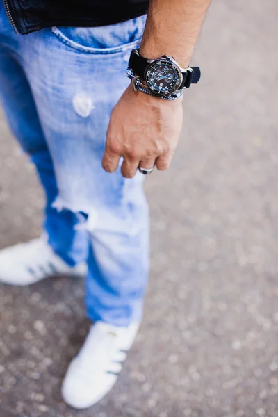 Stylish young man in watch