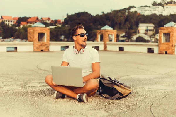 Young man   working on laptop