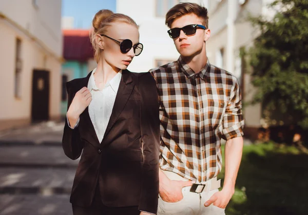 Fashionable couple in sunglasses