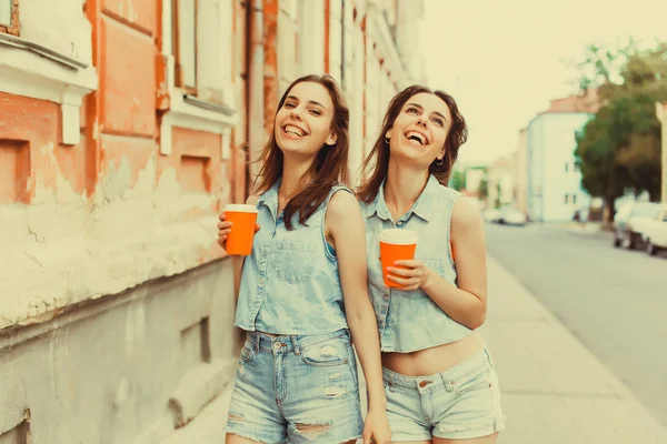 Girls  drinking coffee on the street