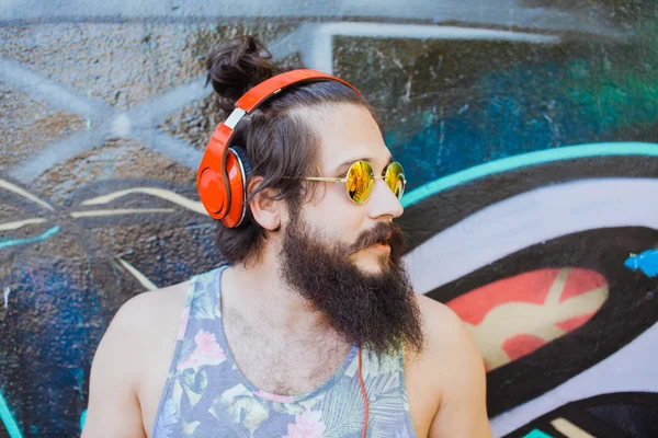 Guy with  listening  music with headphones