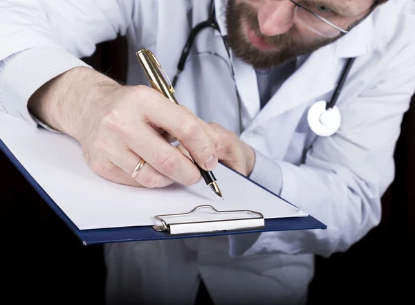 Close-up hands of a medical doctor, the doctor signs a handle documents. Doctor writes medical history. write a prescription patient data history