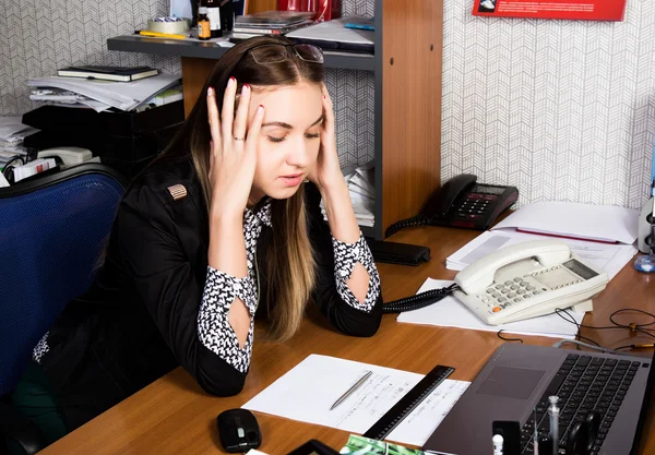 Beautiful office female worker in panic holding his head. office concept