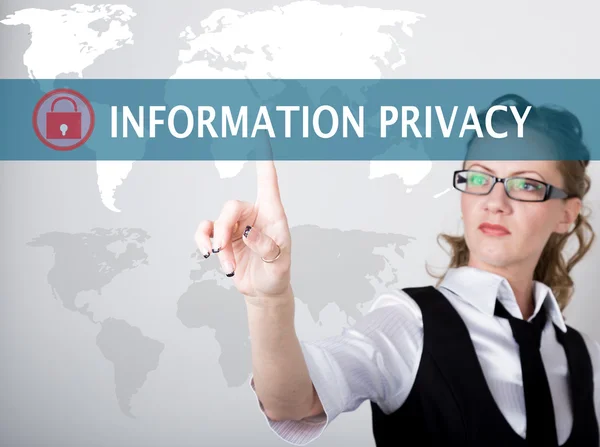 Information privacy written on a virtual screen. Internet technologies in business and tourism. woman in business suit and tie, presses a finger on a virtual screen