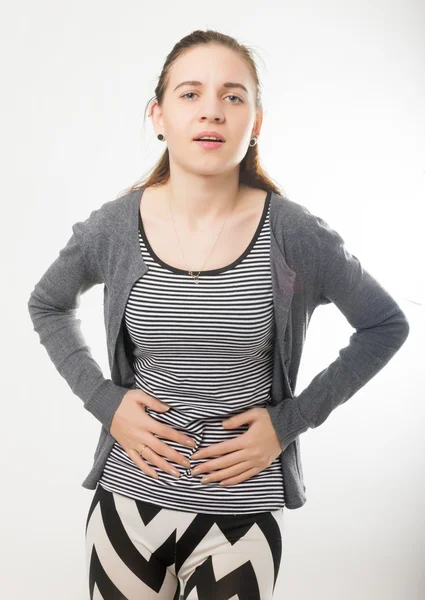 Menstruation pain or stomacbeautiful young girl holding her stomach, abdominal pain during the menstrual cycleh ache