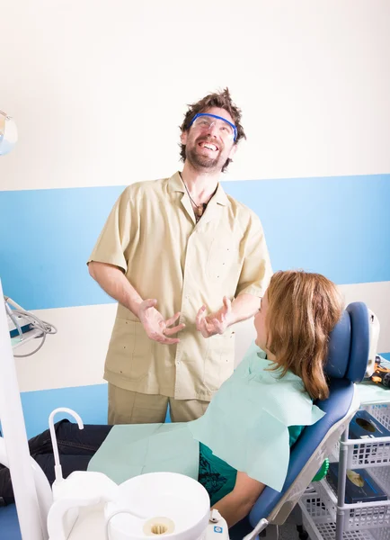 Crazy dentist treats teeth of the unfortunate patient. The patient is terrified.