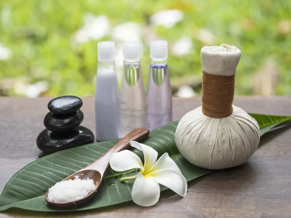 Spa massage compress balls, herbal ball on the leaves with rock spa, Thailand, select focus