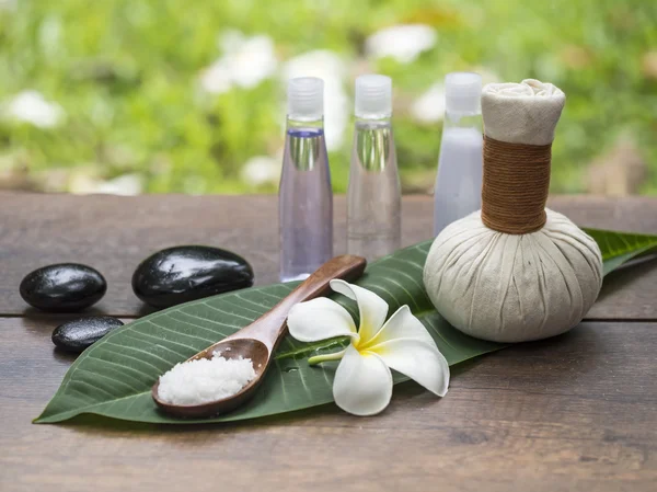Spa massage compress balls, herbal ball on the leaves with rock spa, Thailand, select focus