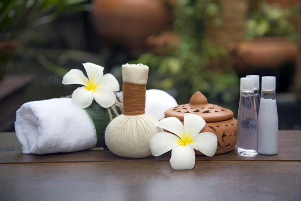 Spa massage compress balls, herbal ball on the wooden with treaments spa , Thailand, soft focus