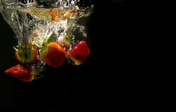 Photo of a fruits dropped under water