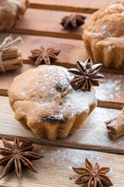 Fresh bread cakes covered powdered sugar and decorated anise star