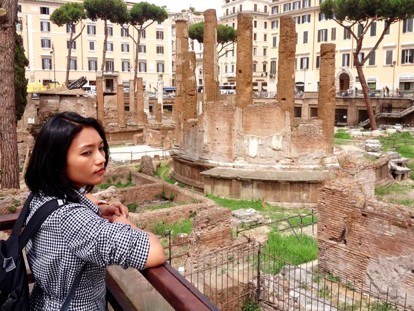 Rome tourists looking at Roman Forum landmark in Rome.