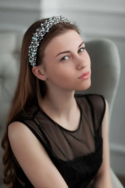 Young beautiful girl posing in the interior studio