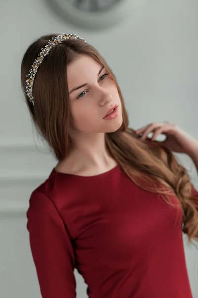 Young beautiful girl posing in the interior studio