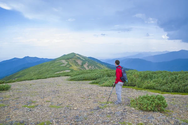 A tourist traveling on the mountain route.